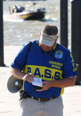 BASS Tournament Manager, John Stewart, checks the anglers list to make sure every boat has returned safely to the launch area.