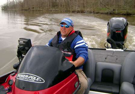 After a short time surveying the water, Herren makes a move, idling through the stump-filled Red River backwaters.