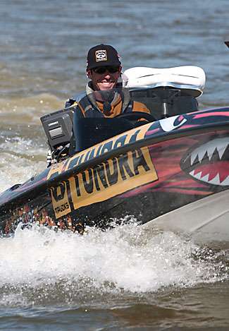 Michael Iaconelli makes his way out of a backwater area and out onto the main river as Reese pulls into the same area.