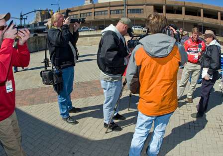 Cameras surround Kelly Jordon during media day.