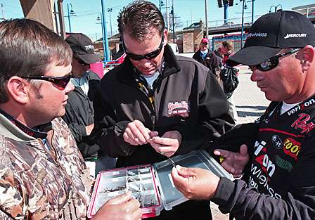 Kevin VanDam (center) and Scott Rook (right) check out the new Youvella hooks designed in part by Greg Hackney (left).