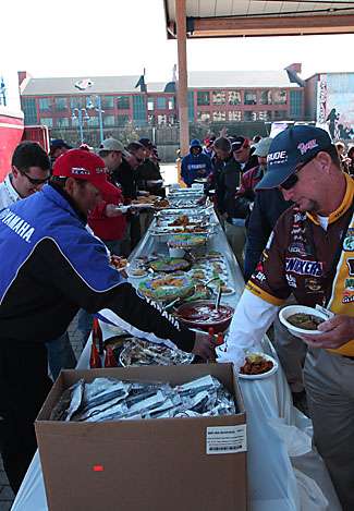 Dean Rojas (left) and Greg Pugh (right) make their way through the buffet-style food line.