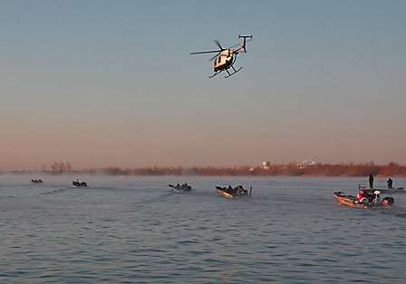 The ESPN helicopter follows the competitors as they idle out to the no wake buoy's at the Red River Marina.