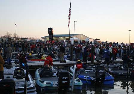 Fans, anglers and BASS officials stand for the national anthem.
