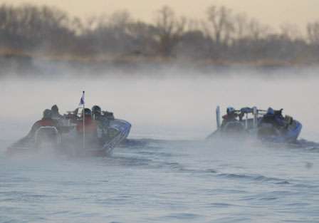 Anglers take off through the fog.