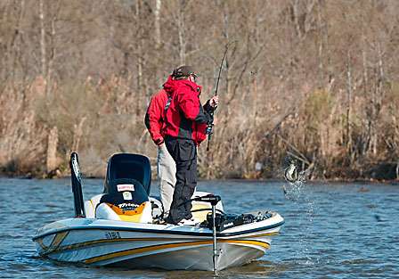 Baumgardner swings the bass into his boat.