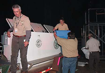 The fish are passed along until, ultimately, they end up at an oxygenated tank that sits just behind the stage. The bass become the responsibility of the Louisiana Dept. of Wildlife and Fisheries and are returned to the Red River.