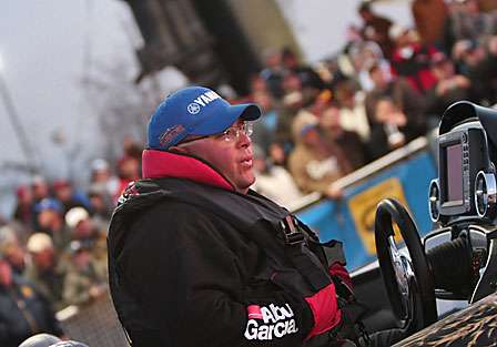 The crowd cheers as Bill Lowen is backed into the Red River during the Day Two launch of the Bassmaster Classic.