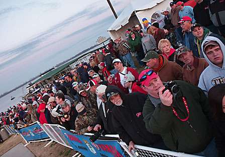 Fans take photos and cheer on the anglers as the launch unfolds in front of them.