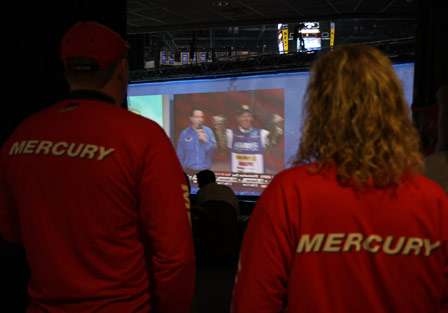 Mercury representatives stand behind the large screen just off stage and watch the show through the screen.