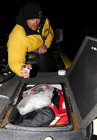 Skeet Reese organizes his boat before the final day takeoff of the Bassmaster Classic.