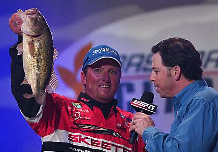 Kelly Jordon holds up one of the bass that helped him to a tenth place finish.