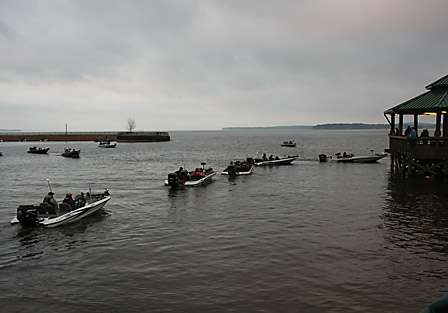 Boats in the third flight make their way through the inspection line.