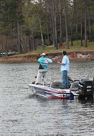 Narramore hooks into another fish within just a few casts, while his co-angler Leigh Fuselier looks on.