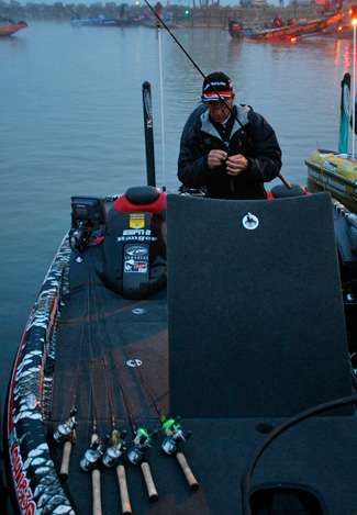 Charlie Hartley tweaked his fishing gear while waiting to launch on Day One.