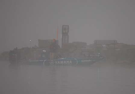 Todd Faircloth's boat is barely visible as the fog thickens.