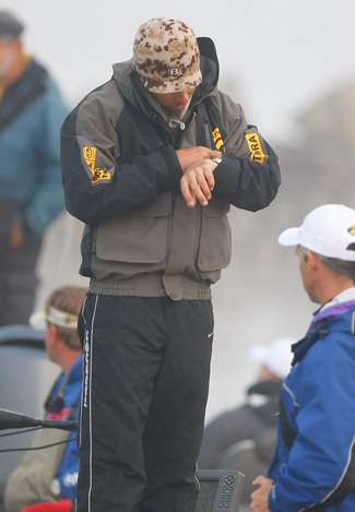 Mike Iaconelli takes a look at his watch as the launch delay nears two hours.