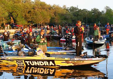 The Top 50 Elite Series competitors and their co-anglers stand for the National Anthem. 