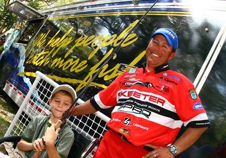 After weighing his fish, Dean Rojas gave 7-year old Jacob Bainter of Orlando, Fla., the rod and reel combination he used on Day Three of the Citrus Slam. 