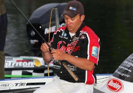 Bryan Hudgins gets his tackle together for the final day of fishing.