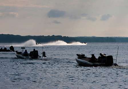 Bassmaster Elite pros take their places in line for a hole shot as others speed down the lake to their first stops of the day.
