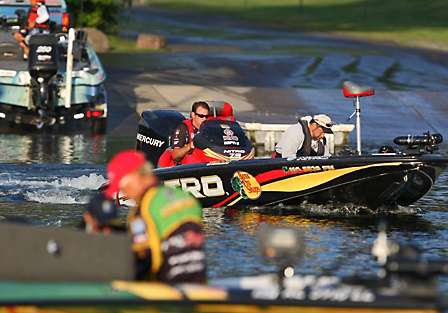 Kevin VanDam leaves the launch area and idles toward Timmy Horton and the take-off area where fans have gathered to see their favorite anglers take off on Day One of the Champions Choice.