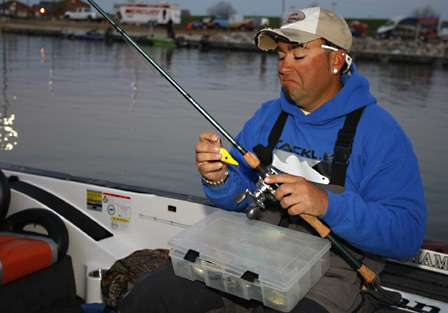 Bassmaster Elite Series angler Jason Quinn (37th place, 23 pounds, 1 ounce) preps his tackle before takeoff.
