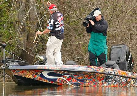 Tommy Biffle flips his first keeper fish into the boat.