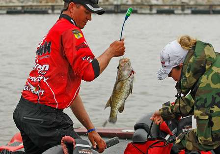 Casey Ashley sacks his fish, which includes a mixture of both smallmouth and largemouth bass.