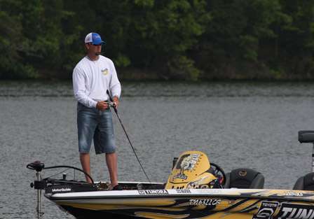 Calm waters ease the bite for Elite Series Pro Gerald Swindle as he fishes a creek arm in the upper end of Wheeler Lake.