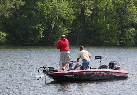 It isn't long before Vinson is hooked up and bringing a bass to the boat.