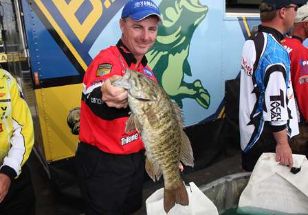 Bassmaster Elite Series pro Mark Menendez holds up a very healthy Wheeler Lake smallmouth bass that will eventually be released back into the lake to be caught again.