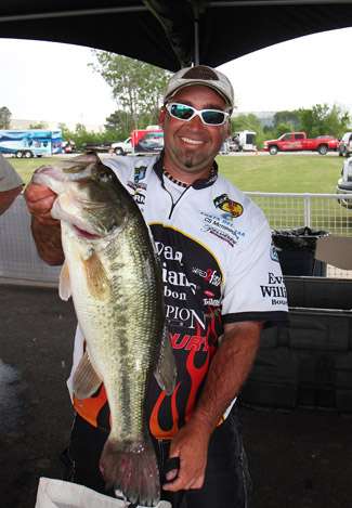 Elite Pro Jason Quinn holds one of the healthier largemouth's brought to the scales on Day One.