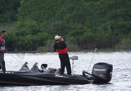 Payne's co-angler, Rob Moodie, sets the hook on a bass and fights it to the boat. It was his first of the day.