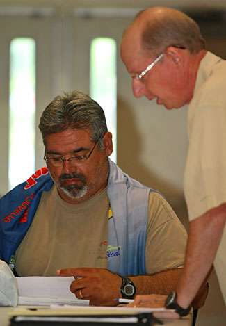 Peter Thliveros makes sure he gets clarity on any rules by sitting close to BASS Tournament Director Trip Weldon during the anglers meeting.