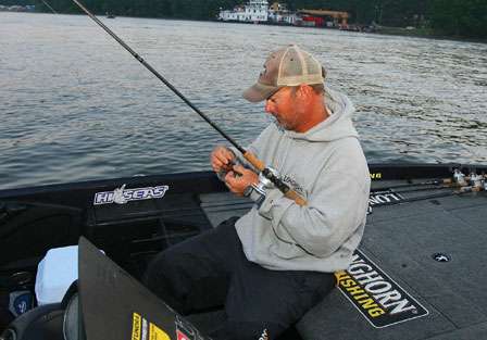 Jeff Kriet ties on a lure in preparation for the third day of competition.