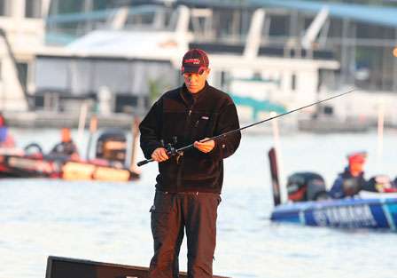 Aaron Martens, winner at the last event on Lake Guntersville, prepares a few rods before the day of competition.