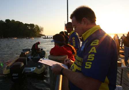 BASS officials finish checking in the last of the 50 boats that will be competing on Friday.