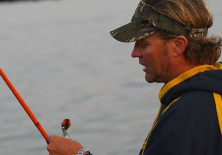 Byron Velvick uses his time wisely, preparing his tackle and equipment for Day Four action.