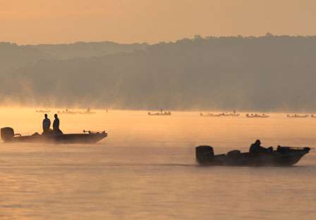 Through the fog, spectator boats can be seen waiting patiently for the tournament day to begin.