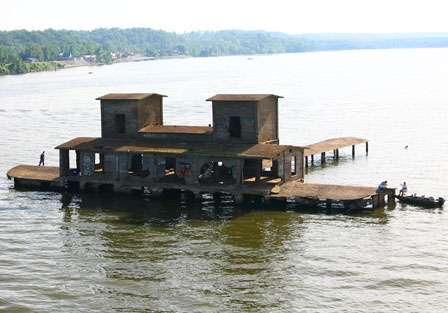 An old building still stands in the middle of Kentucky Lake and now serves as a place for people to fish off of.