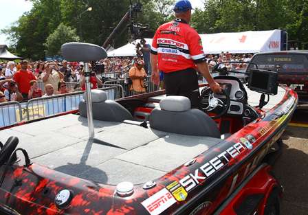 Kelly Jordon instinctively steers the wheel as he is driven up to the stage to weigh his fish on Day Four.