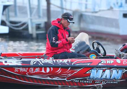 Casey Ashley takes some time to rig a few lures for his day on the waters of the Mississippi River.