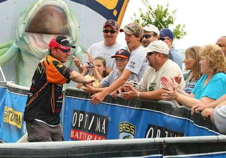 Mike McClelland greets fans as he brings his fish to the scales. With just one fish on Day Four, McClelland finished in 12th place with 29 pounds, 5 ounces.