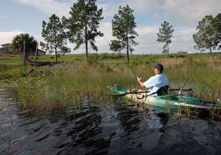 Chris Horton targets a lily pad, Kissimmee grass mix in hopes for a Florida largemouth.