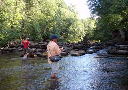 Chris Horton and David Jones wade a small tributary off the Flint River. The small pools and deep holes between shoals are where the smallmouth call home.