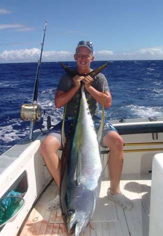 Little Alton with his 150-pound yellowfin (ahi) tuna.