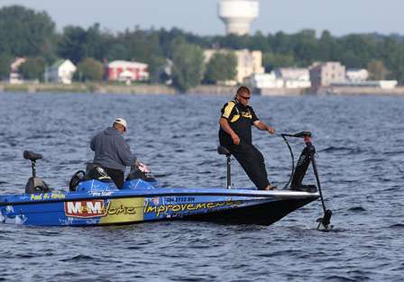 Paul Loman pulls the trolling motor as his co-angler Peter Larmand stowes his gear getting ready for his second run of the day.