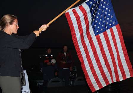 Anglers and fans honor the flag as the national anthem is heard throughout the Plattsburgh Boat Basin.