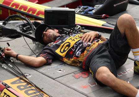 Bassmaster Elite pro Michael Iaconelli crashes on the front deck of his boat after a tiring day of fighting waves and a grueling ride back to the Plattsburgh Boat Basin.